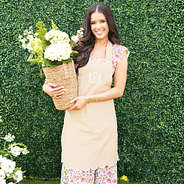 khaki scalloped apron on peyton with flowers