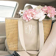 monogrammed caning tote bag in car