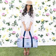 girl carrying monogrammed wire top extra large tote in blue shells with flowers