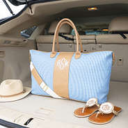 Navy seersucker weekender in car trunk