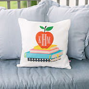 teacher monogrammed pillow sham in apples and books outside