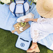 bunny on personalized picnic blanket and cooler in navy seersucker