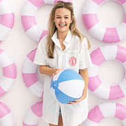 girl wearing white monogrammed fishing shirt with pool floaties