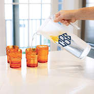 monogrammed acrylic pitcher with nesting cups in clear pouring