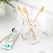 clear tooth brush holder with toothpaste