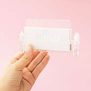 Girl holding personalized business card holder stand phrase