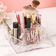 personalized makeup organizer on pink background with brushes