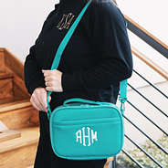 girl carrying personalized neoprene lunch bag in teal over shoulder