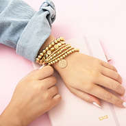 gold lightweight bracelets on girl