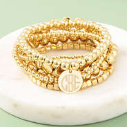 gold lightweight bracelets on marble