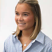 girl wearing silver bow necklace