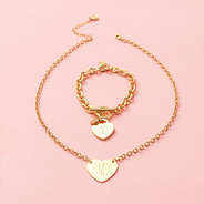 gold heart pendant necklace with heart bracelet