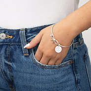 girl wearing silver bow bangle