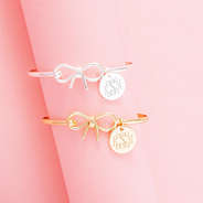 gold and silver bangles on pink