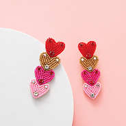 pink layered heart earrings studio shot