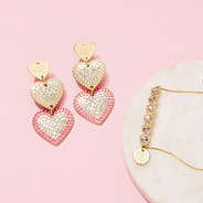 monogrammed rhinestone heart bracelet and earrings on pink