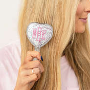 pink purse brush in hair