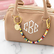 multi bag charm keychain across small bag