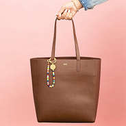 multi bag charm keychain on leather bag