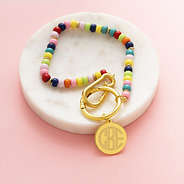 multi bag charm keychain on marble dish