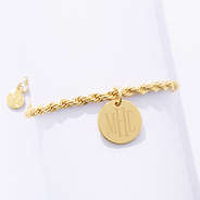 close up of gold personalized twisted rope bracelet