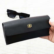 black sunglasses case in hand
