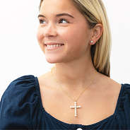 girl wearing pearl cross necklace and 8mm earrings
