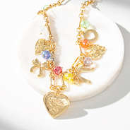 beaded charm necklace on marble dish