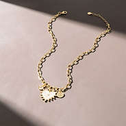 Charm heart necklace on brown