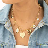 gold charm necklace on girl