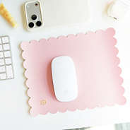 pink scalloped mouse pad on office desk