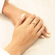 gold adjustable criss cross ring on hands