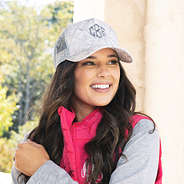 girl wearing camo trucker hat