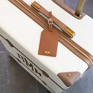 brown luggage tag on luggage