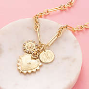 Sun heart necklace on marble dish