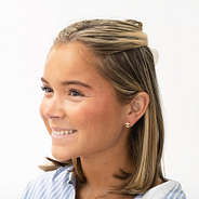 girl wearing anchor earrings