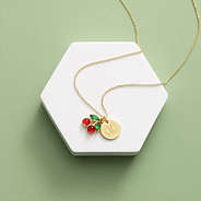 cherry necklace on green