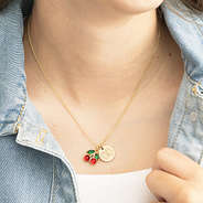 girl wearing monogrammed cherry necklace