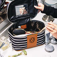 monogrammed train case in bathroom