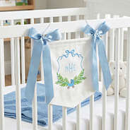 blue new baby banner on crib