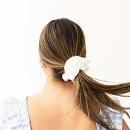 white scrunchie on girls hair