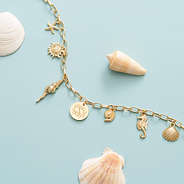 Seashell Charm Necklace on blue
