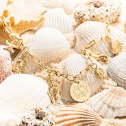 Seashell Charm Necklace on shells