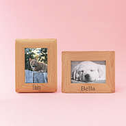 two personalized pet photo frames on pink