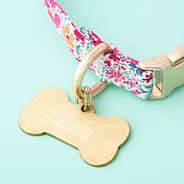 gold dog tag up close