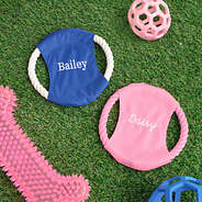 pink and blue personalized frisbees with dog toys