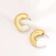enamel hoop earrings on fabric