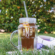 close up of personalized mason jar in grass