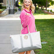 striped weekender with pink pullover outside