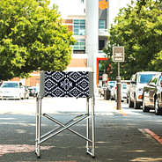 aztec patterned monogrammed tailgate chair at football stadium